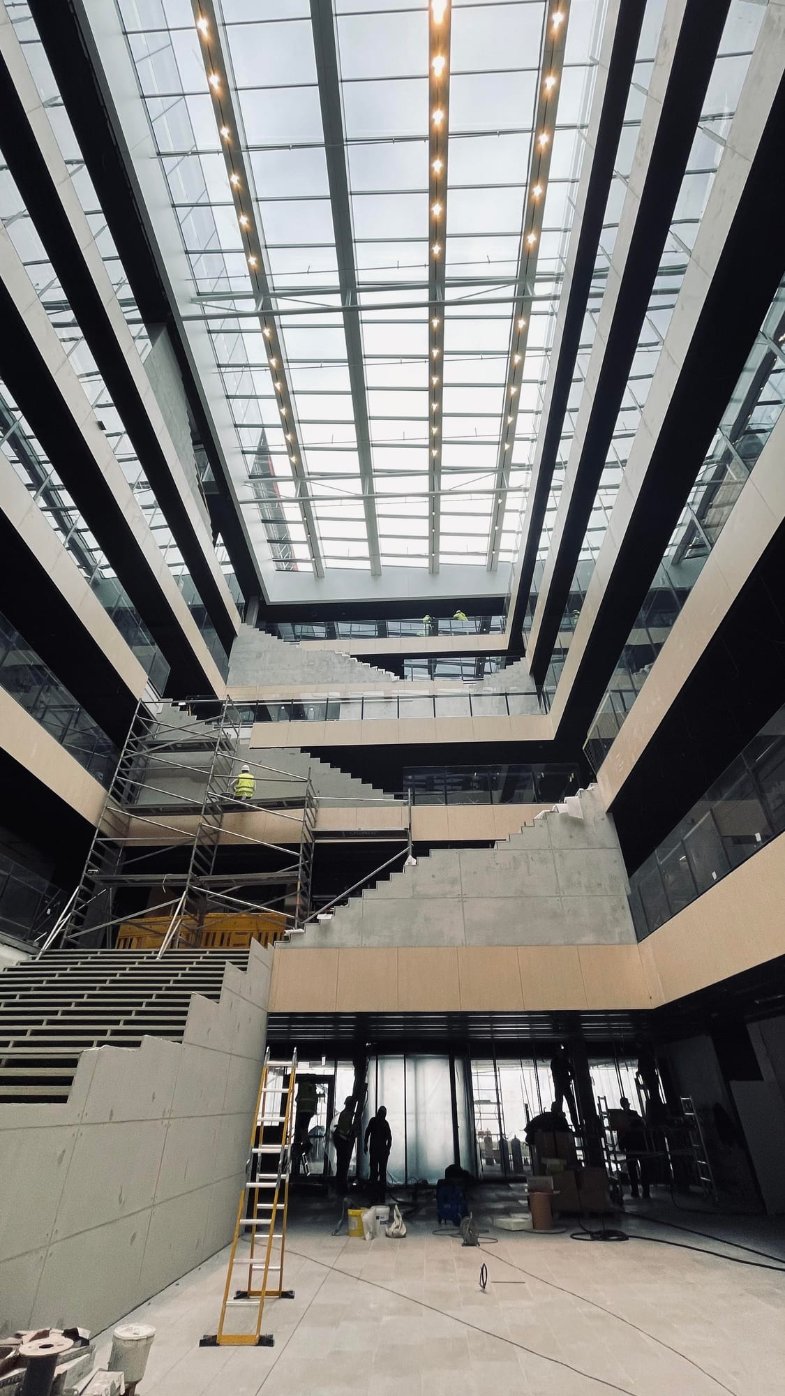 Business centre atrium under construction — skylight and staircases